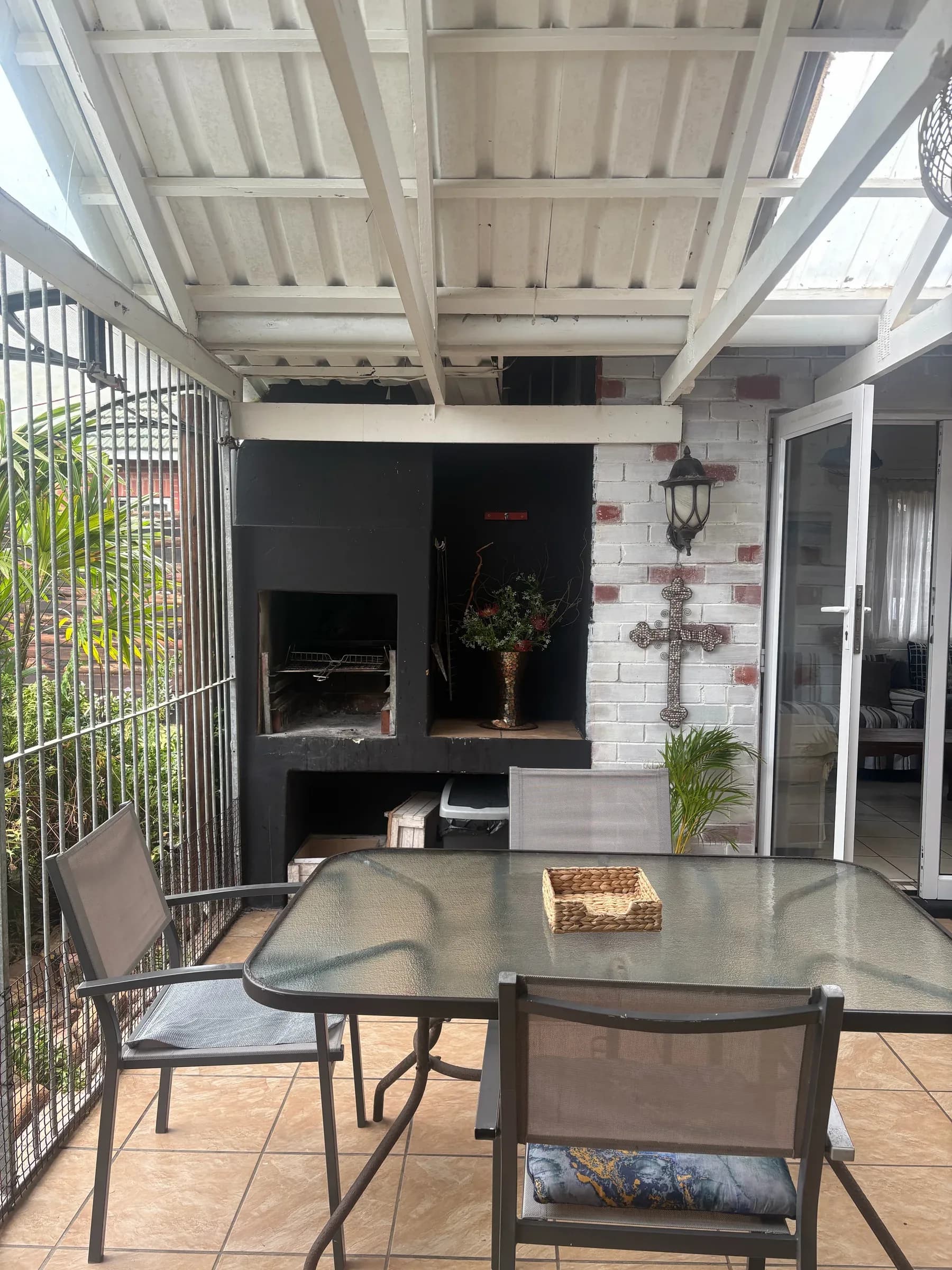 Patio dining table beside the braai